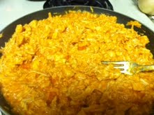 Chicken breasts shredded up and saturated in buffalo wing sauce.  This is the bottom layer of the dip.