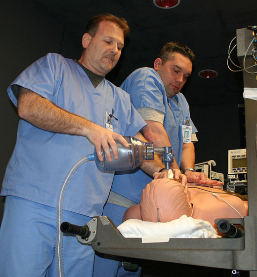CPR being done by Air Force physicians on a "dummy" used for resuscitation training.