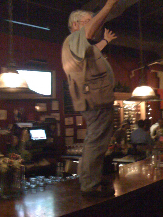 This is Kevin.  He is a nature photographer and likes to climb up on the bar after he's had a couple of whiskey-soda's. I told him if he could bring me pictures of him on five different bars I would buy him dinner. 