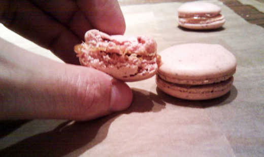 The ideal macaron has a crisp thin shell, a soft pillowy center, and a complementary filling between the halves. (Here, I've put a carmelized white chocolate ganache) 