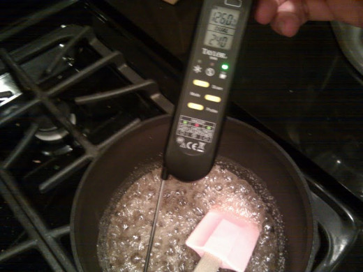 The "cooked sugar" (sucre cuit) will be bubbly and frothy, but will not caramelize, due to the presence of the water. 