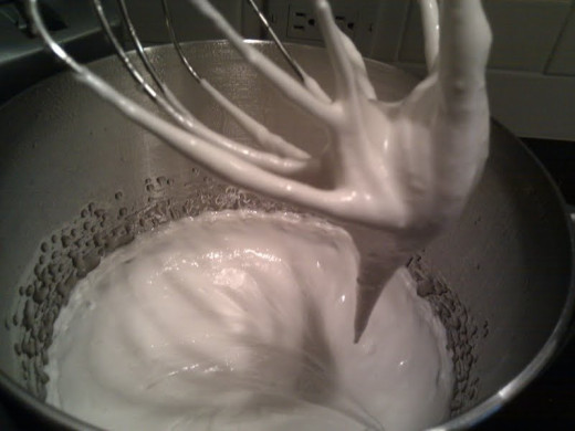 Slowly drizzle the melted sugar in... 