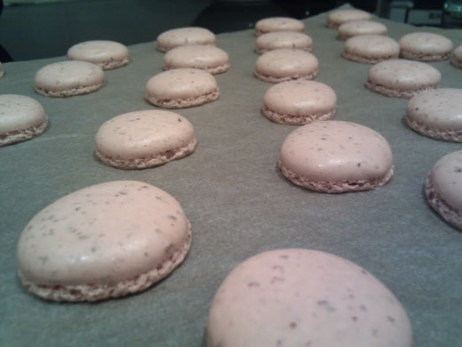 Your macarons should be flat on top, with "feet"--the ruffly bottoms you see here. 