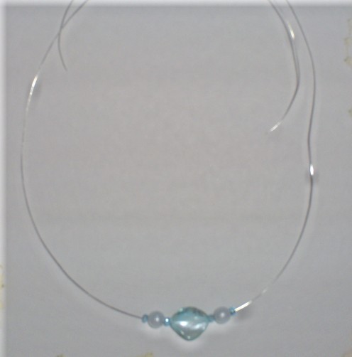 Add two more blue seed beads to the necklace.