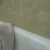 Wiping Off the Water on A Bathtub with A Towel Wiping Off the Water on A Bathtub with A Towel