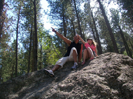 My daughter and her big brother perched on a rock on our Mount Rushmore hike. 