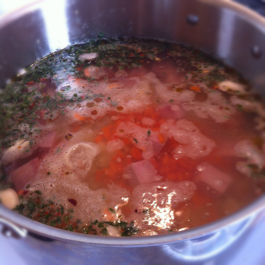 This watery pot will thicken over 3 hours of cooking from the starch of the beans and minced potato.