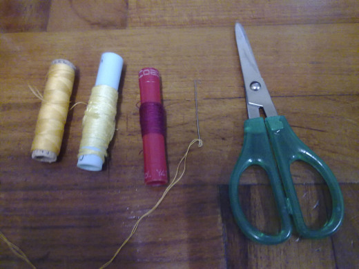 needle, threads and scissors