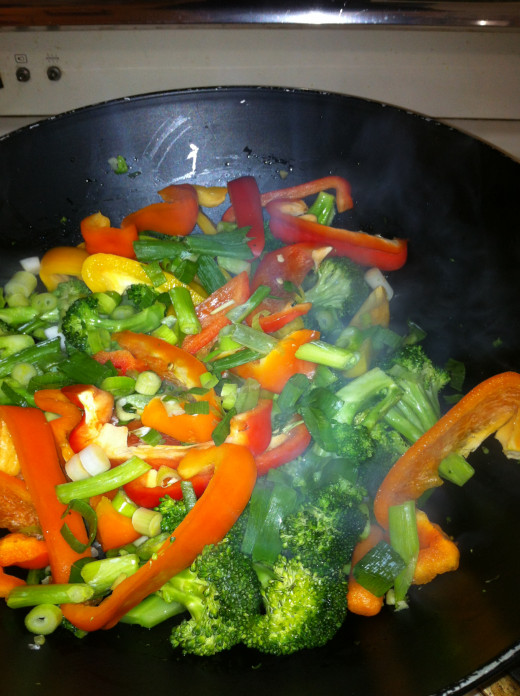 Add the peppers and green onions.