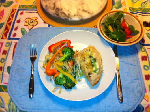 Stuffed Chicken Breasts with a veggie stir fry and a side baby spinach salad.