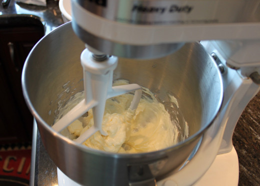 Beat softened butter until creamy.