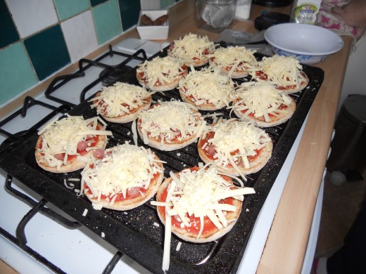 Sprinkle on your cheese - as you can see, I like my pizzas cheesy