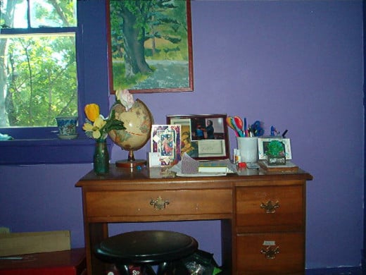 My daughter's study nook has supplies, artwork, and her favorite shade of purple!