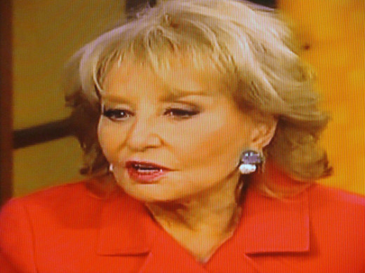Barbara  Walters talks with other ladies.