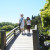 People Walking on A Bridge in Japanese Friendship Garden San Jose CA People Walking on A Bridge in Japanese Friendship Garden San Jose CA