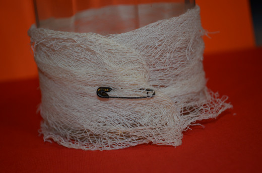 Wrap cheesecloth and pin with safety pin