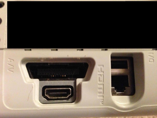 The A/V port is located in the back right corner of your Xbox 360.