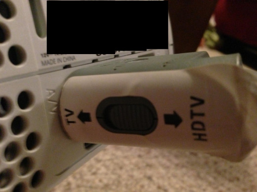 Set the side switch to match the type of TV you're connecting it to.