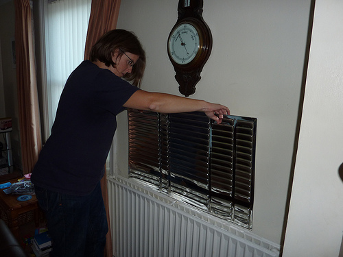 An example of a radiator panel being inserted, possibly using sticky tape