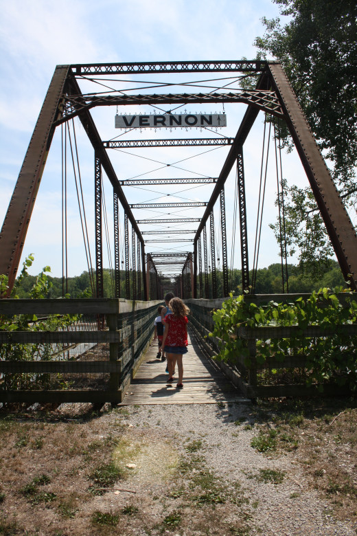 Walking onto the bridge toward Vernon on the other side of the river.