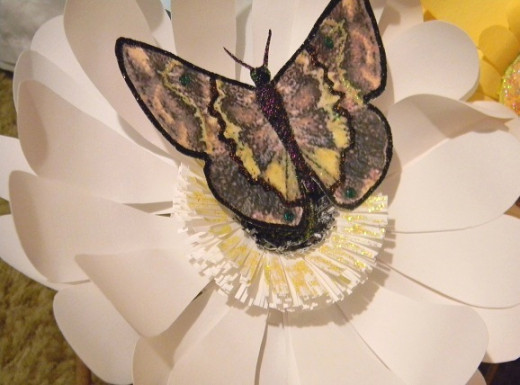 The butterflies are also made of cardstock and glittered.