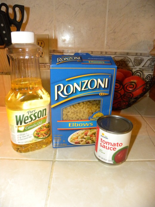 Elbow Macaroni Oil Tomato Sauce Seasoning...salt, chicken cube...whatever you like (best if salt based)