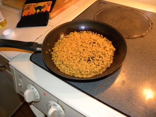 Add about 1 cup of noodles to hot oil, oil should coat all noodles Keep stirring noodles so they dont burn