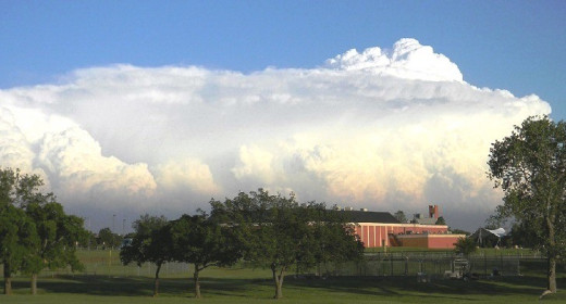 This is a building wall cloud anvil on the back side of a thunderstorm that formed devastating tornadoes east of OKC last year.  Photo taken of campus of Oklahoma Christian University of Science and Arts in far north OKC.