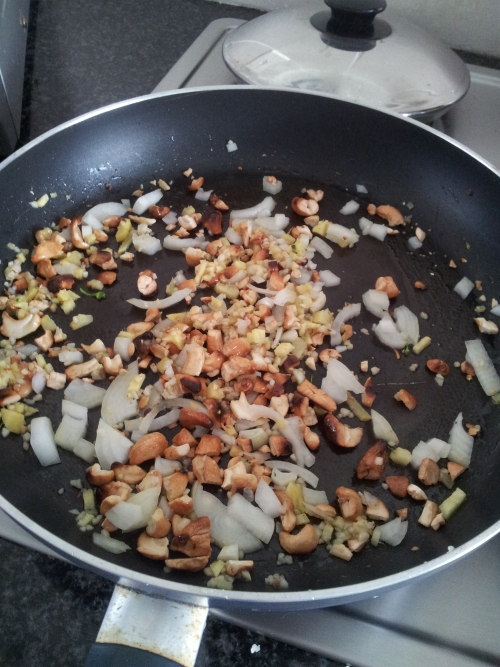 Fry the onions, garlic, ginger and nuts. 