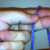 Drape the yarn over your fingers with the tail to the left and the end that leads to your skein of yarn on the right. Drape the yarn over your fingers with the tail to the left and the end that leads to your skein of yarn on the right.