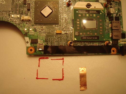 Red epoxy around the chip was removed before reflow.