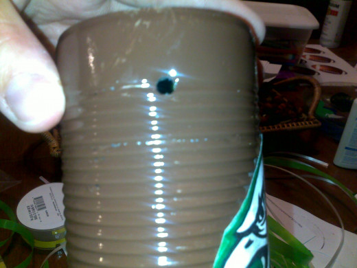 drill a hole in each side near the base of the can an put your favorite team logo on as well