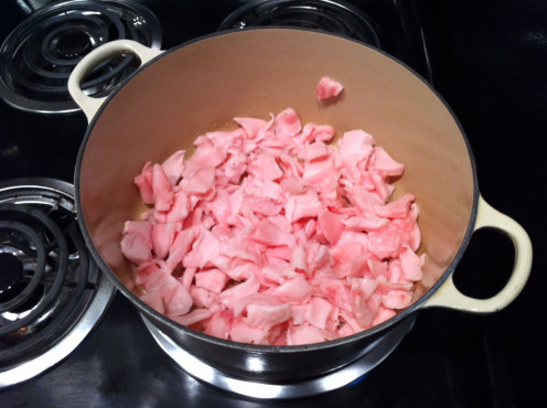 place all of the cut pieces of fat into a heavy pot (this is enameled cast iron) with the water and set on low heat. 