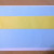 Paste the yellow strip on top the blue paper