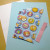 white card, color construction paper and gift wrapper