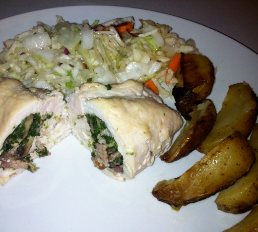 Chicken breasts stuffed with spinach, bacon and mushrooms. Served with homemade ranch roasted potatoes and coleslaw.