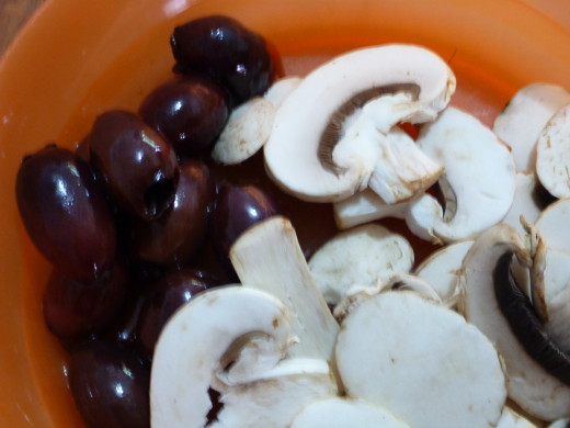 Mushrooms and Olives to put in the Stuffed Capsicums as a layer.