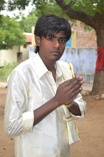 This Tamil youth making a greeting gesture was photographed by Livingston on January 6, 2012 in the state of Tamil Nadu (formerly the state of Madras) in India.