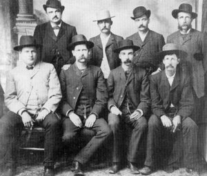 Conkling Studio,Dodge City, June 1883 Front Row: Charlie E. Bassett, Wyatt Earp, M. F. McLain, Neal Brown.  Back Row: William H. Harris, Luke Short, Bat Masterson, W. F. Petillon.