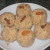 After adding milk make balls with the mixture by putting one raisin on each balls . After adding milk make balls with the mixture by putting one raisin on each balls .