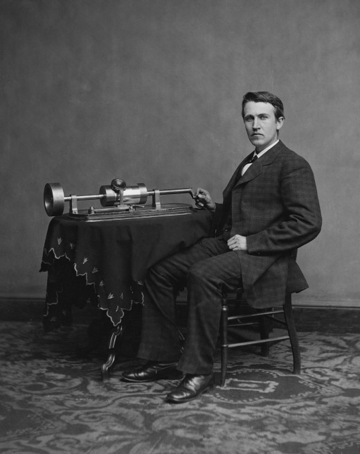 A young Thomas Edison with a phonograph.