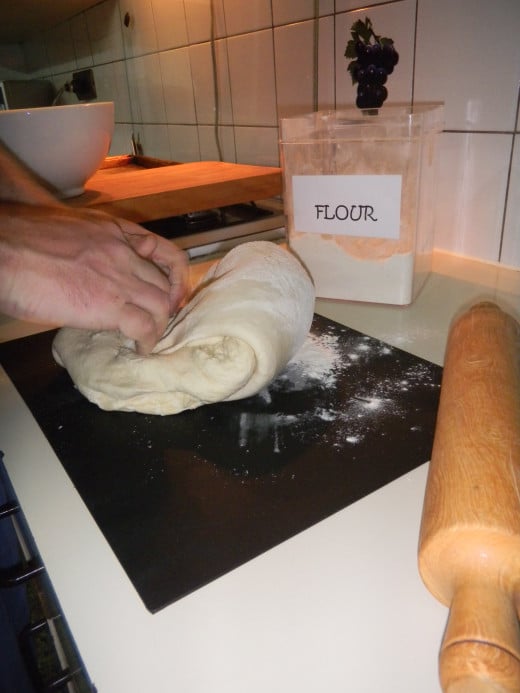 Remove from bowl and knock back and knead the dough by hand
