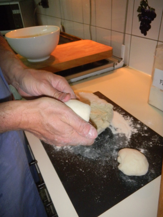 devide the dough to even sizes and knead each piece to small breadcake size