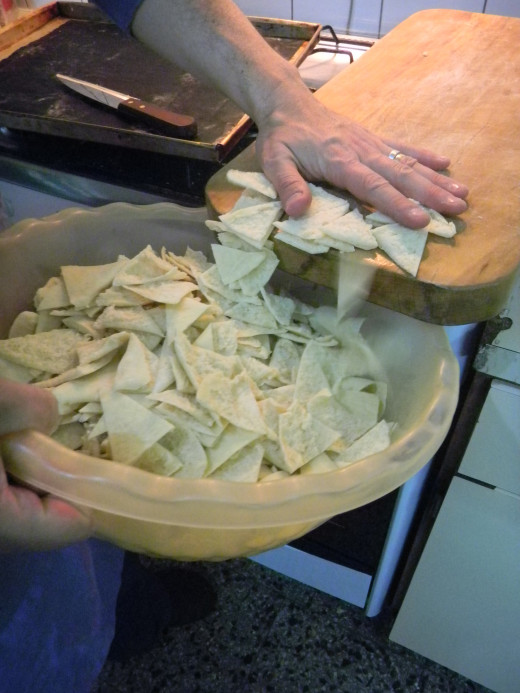 put the triangles into a bowl until ready to oil and salt