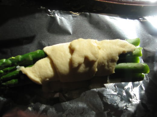 Brush asparagus with melted butter.