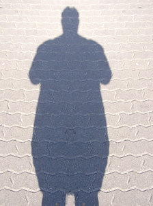 A silhouette of an obese person