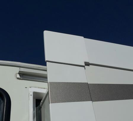 Finished corner with painted plastic cap .