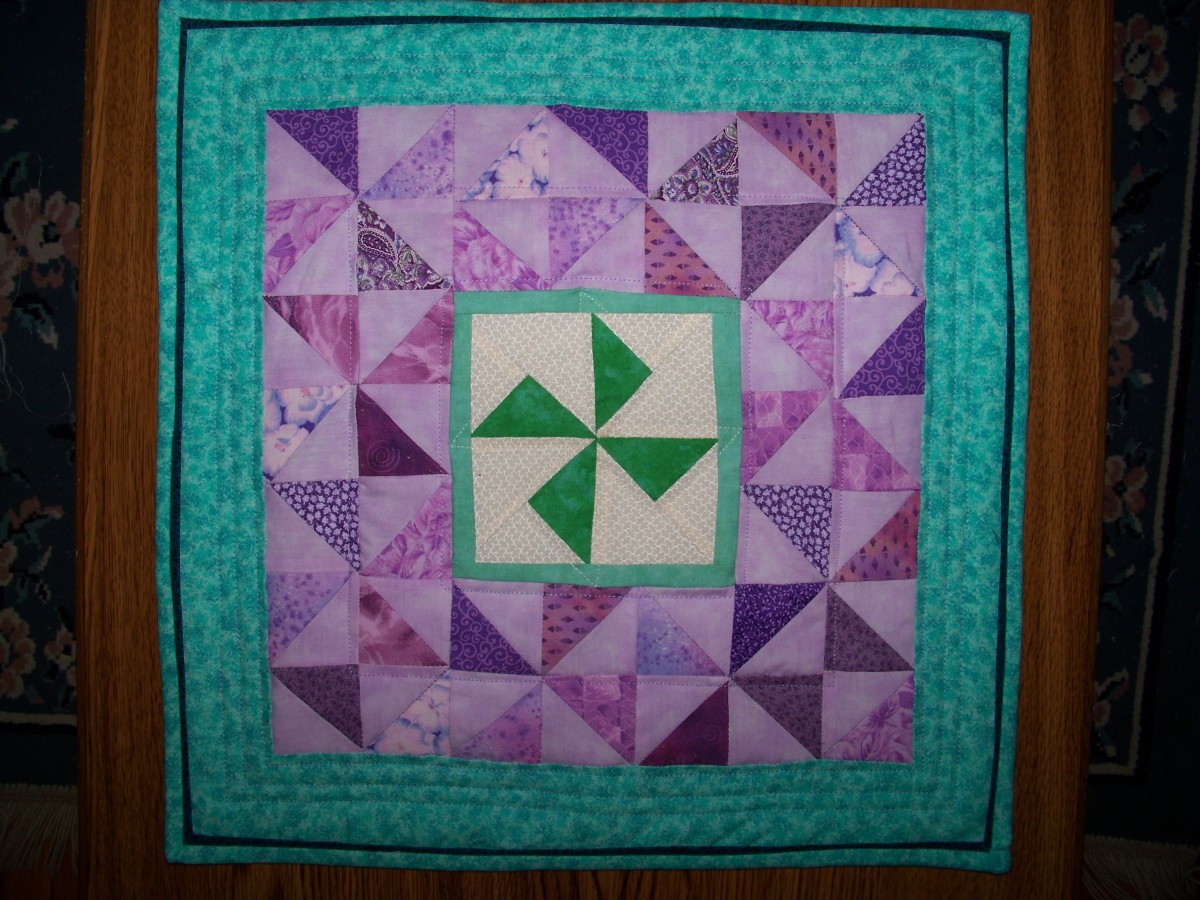 A blue flange added to the binding adds some zing to this pinwheel quilt.