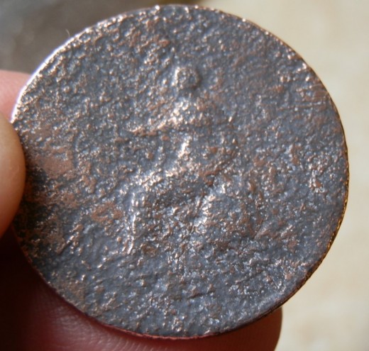 Britannia facing left on the old British coin