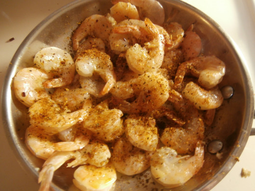 Add as much Cajun spice as you like and fry until the shrimp are pink.